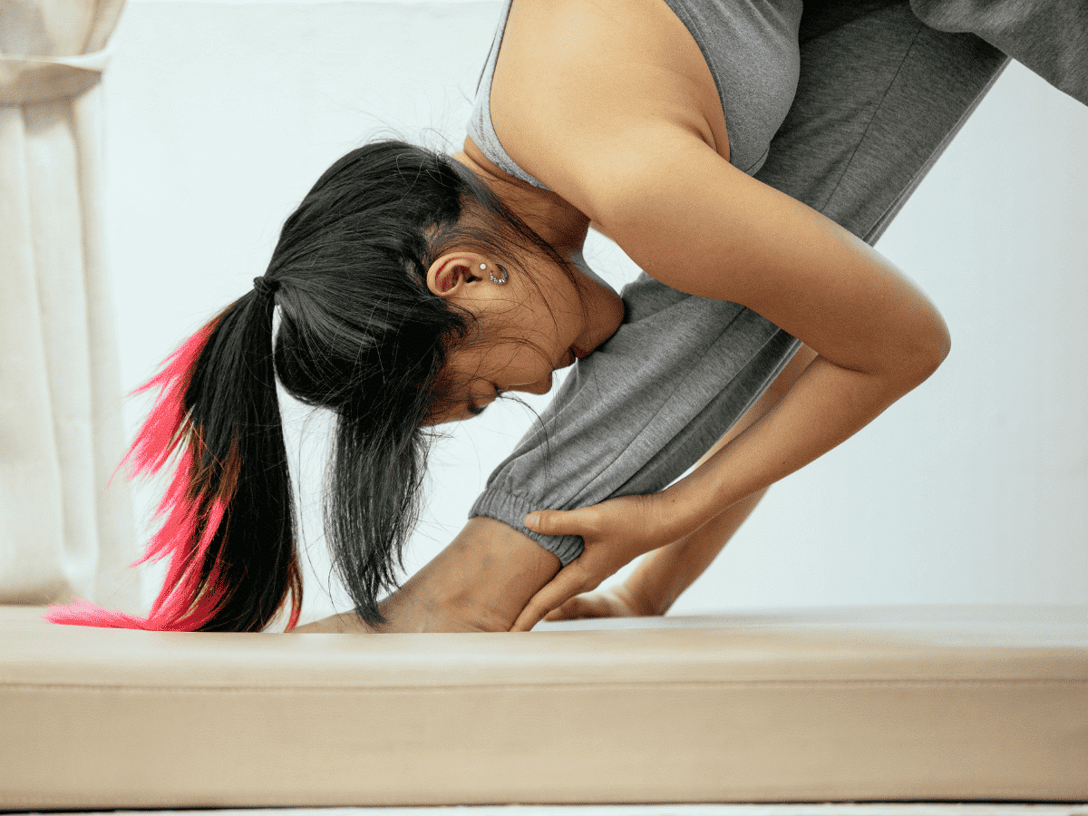 Flexible Woman Doing Pyramid Yoga Pose